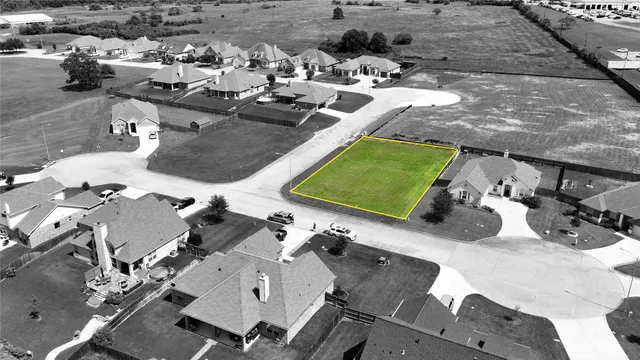 an aerial view of a house with outdoor space