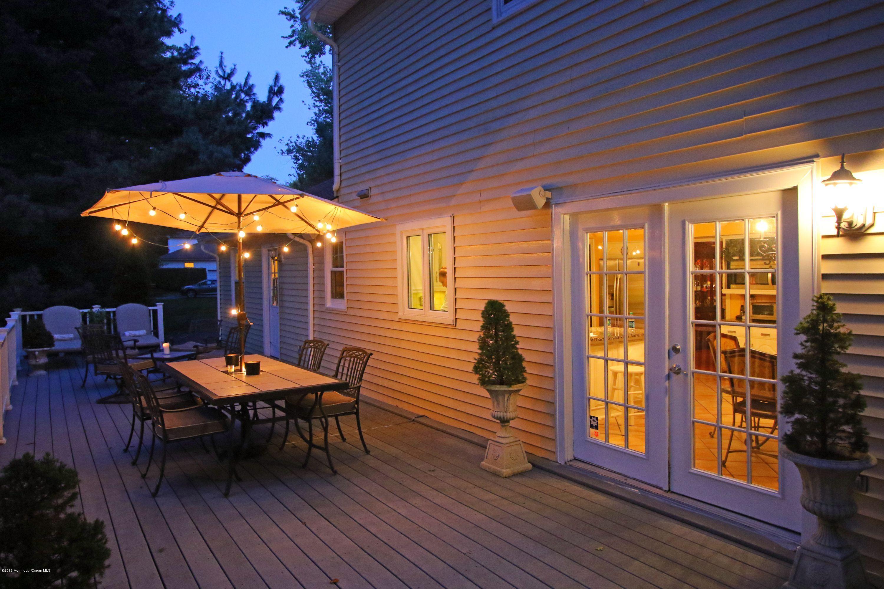 461 Burlington Road Freehold, NJ 07728 - Photo 40 of 47 Twilight deck with sliding doors