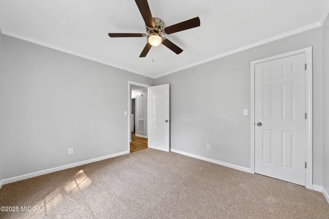 a bathroom with a sink a toilet a mirror and shower