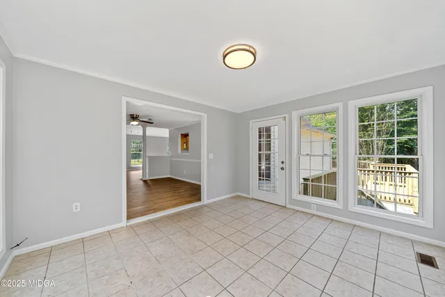 a view of an empty room with a window