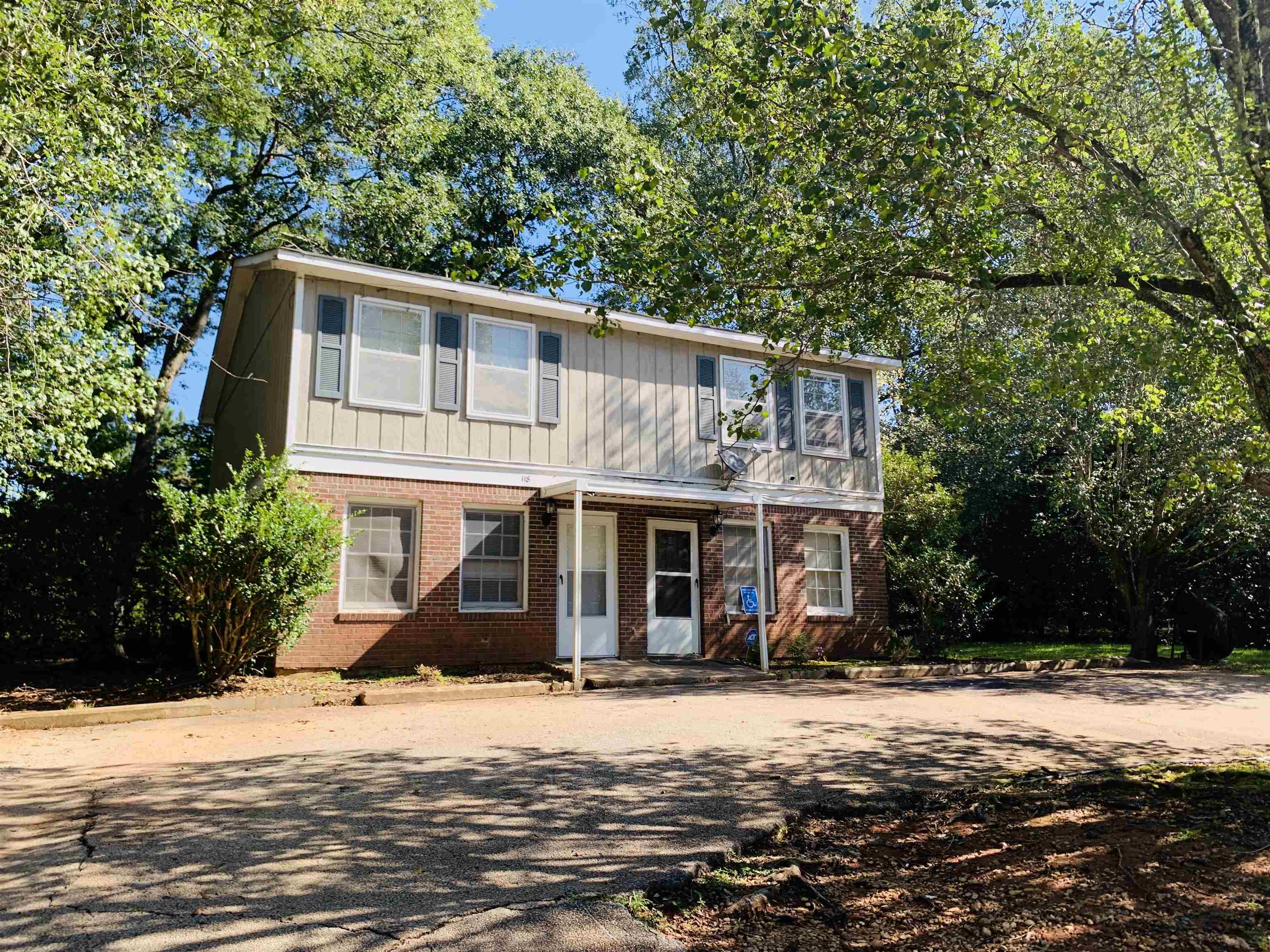 118 Lafayette Court, Unit 118 LaGrange, GA 30241 - Photo 1 of 21 a front view of a house with a yard