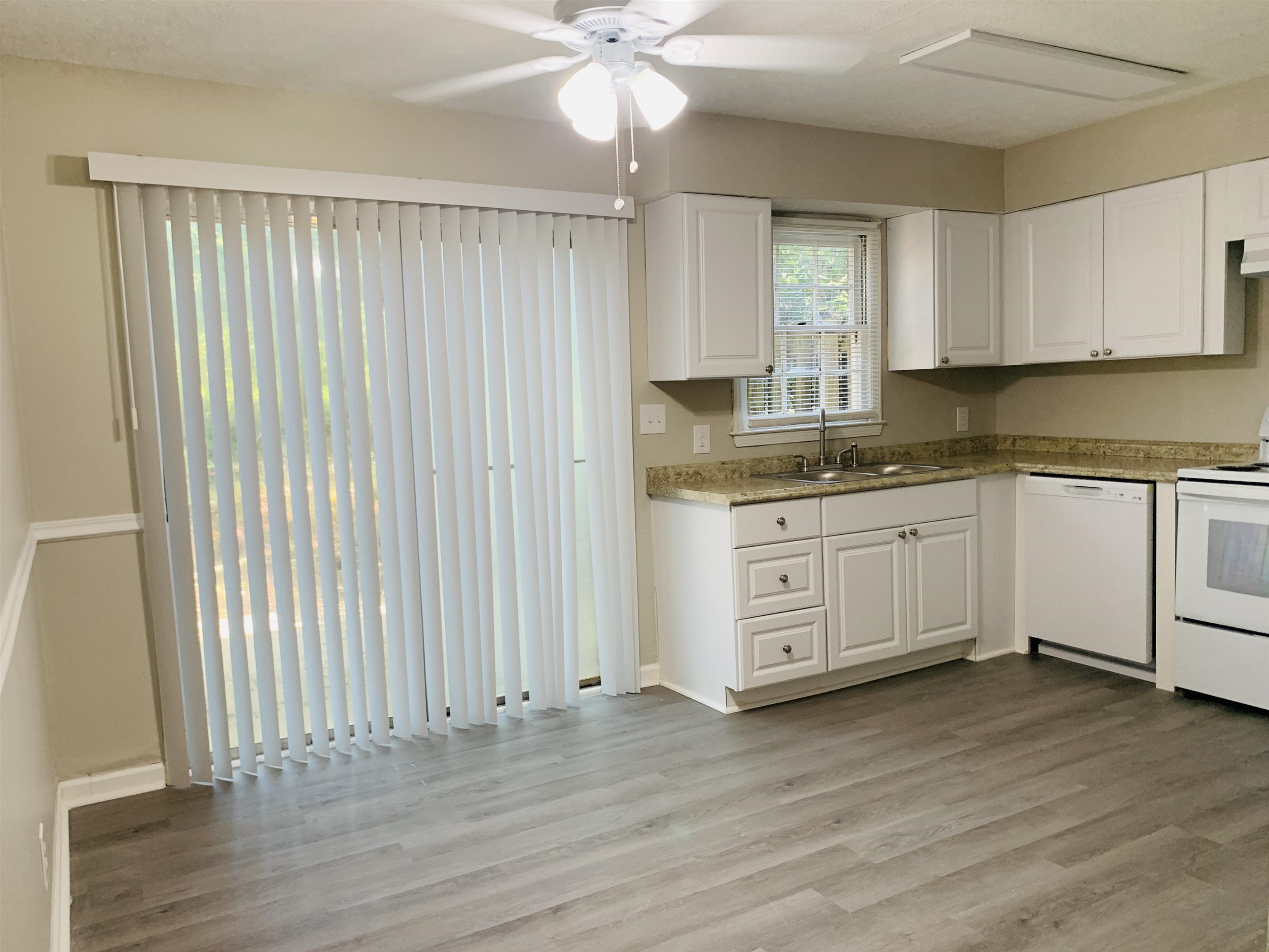 118 Lafayette Court, Unit 118 LaGrange, GA 30241 - Photo 9 of 21 a kitchen with a sink cabinets and wooden floor