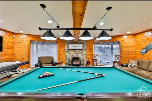 a view of a house with a yard covered in snow