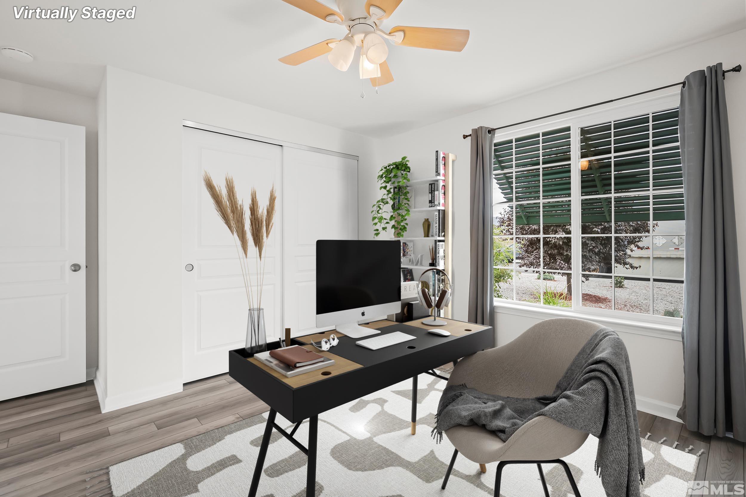 150 Rosecrest Drive Fernley, NV 89408 - Photo 18 of 28 a view of a workspace with furniture and a window