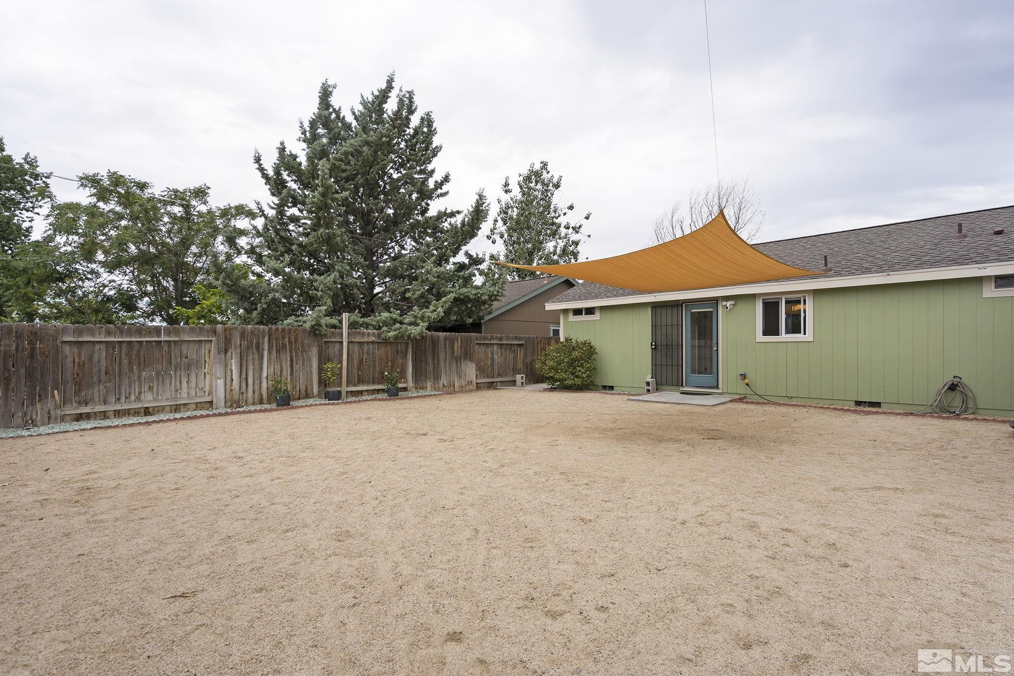 150 Rosecrest Drive Fernley, NV 89408 - Photo 25 of 28 a front view of a house with a yard and garage