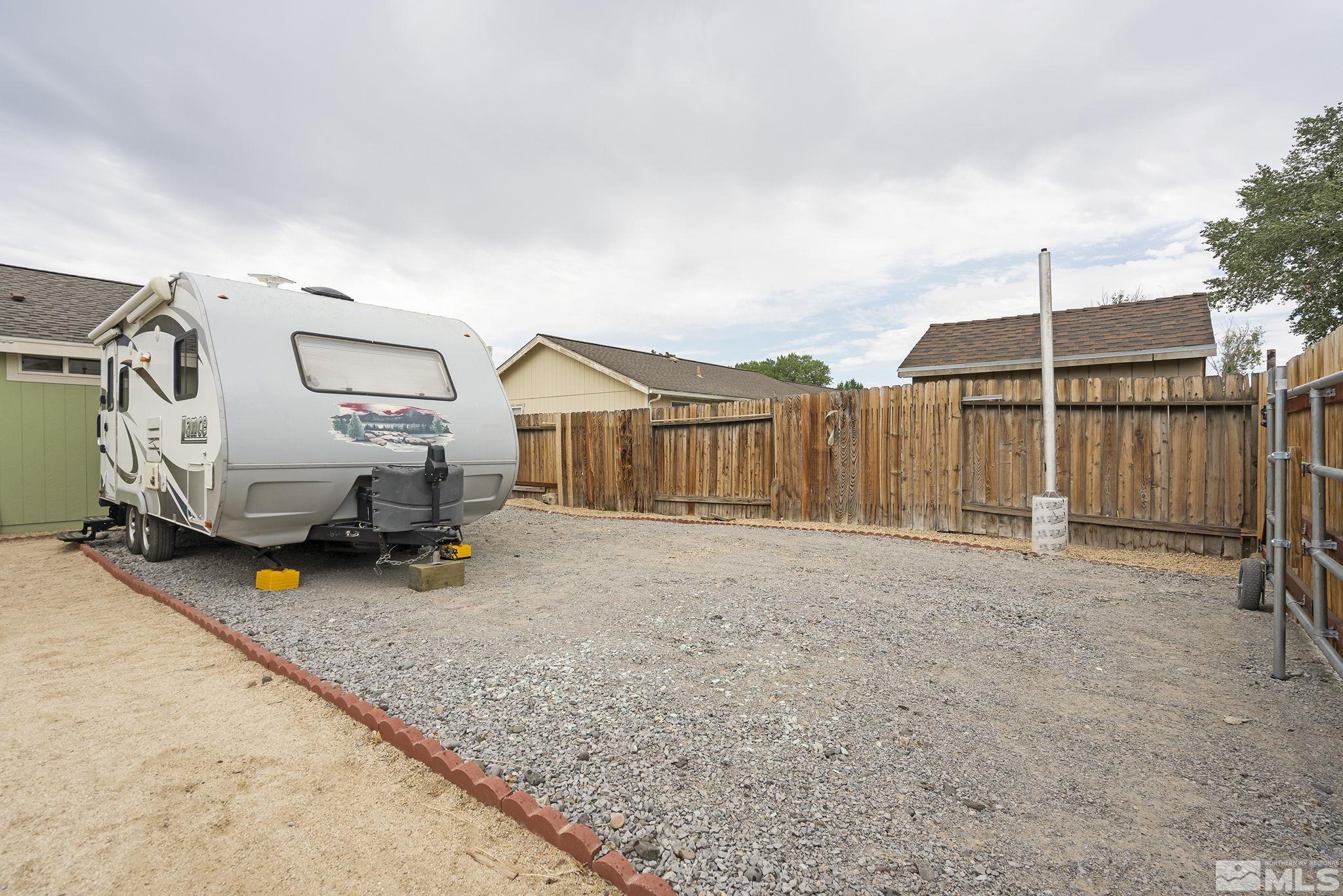150 Rosecrest Drive Fernley, NV 89408 - Photo 26 of 28 a view of a house with backyard and parking