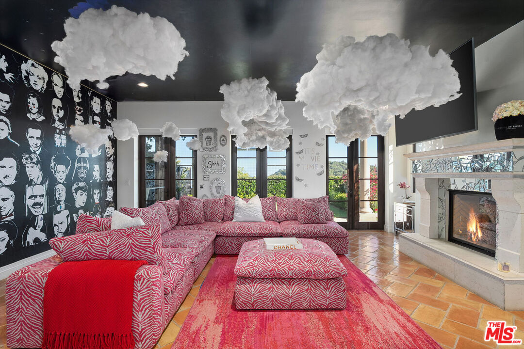 1650 Luse Tank Road Topanga, CA 90290 - Photo 13 of 50 a bedroom with a large bed and a fireplace