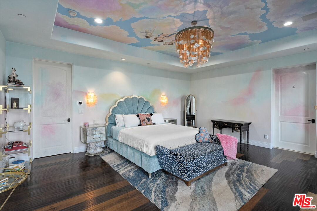 1650 Luse Tank Road Topanga, CA 90290 - Photo 24 of 50 a bedroom with a bed and a chandelier