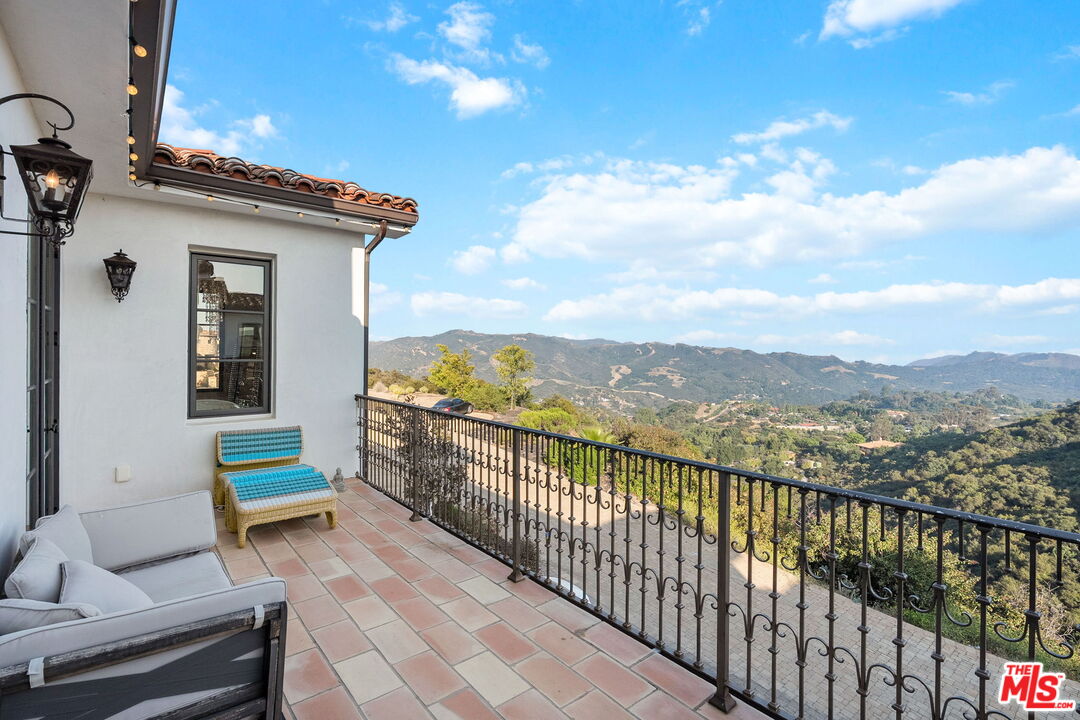 1650 Luse Tank Road Topanga, CA 90290 - Photo 26 of 50 a city view from a balcony with outdoor space