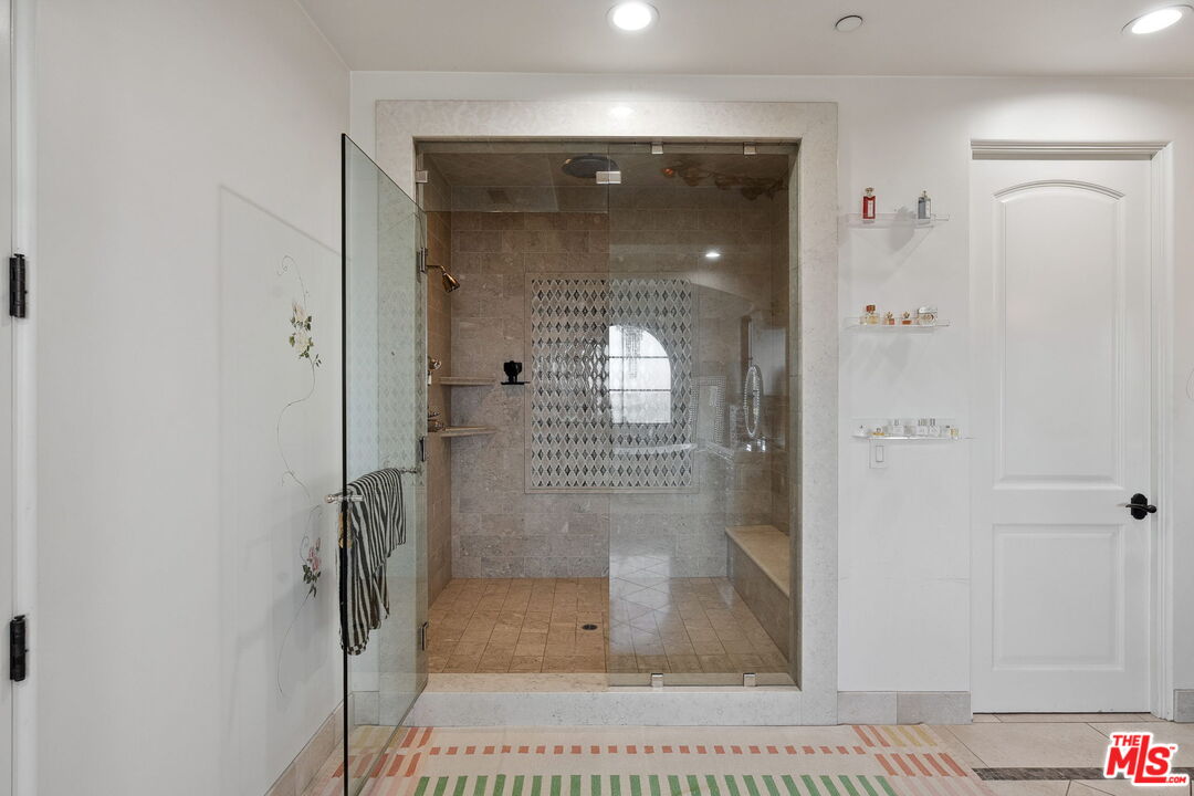 1650 Luse Tank Road Topanga, CA 90290 - Photo 31 of 50 a bathroom with a glass shower door and a glass door