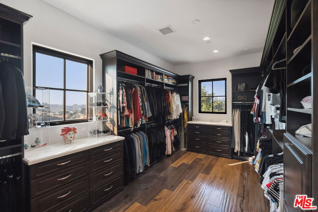 1650 Luse Tank Road Topanga, CA 90290 - Photo 32 of 50 a view of walk in closet with clothes and shoes