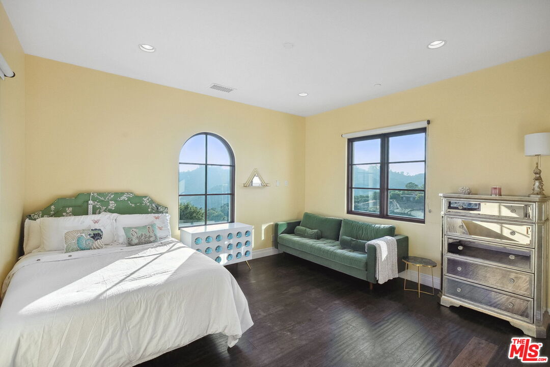 1650 Luse Tank Road Topanga, CA 90290 - Photo 35 of 50 a bedroom with bed and a large window