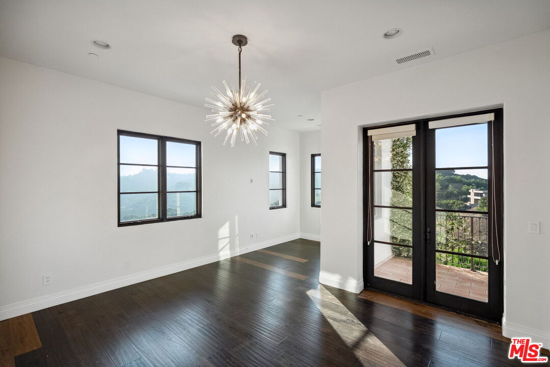 1650 Luse Tank Road Topanga, CA 90290 - Photo 37 of 50 a view of an empty room with wooden floor and a window