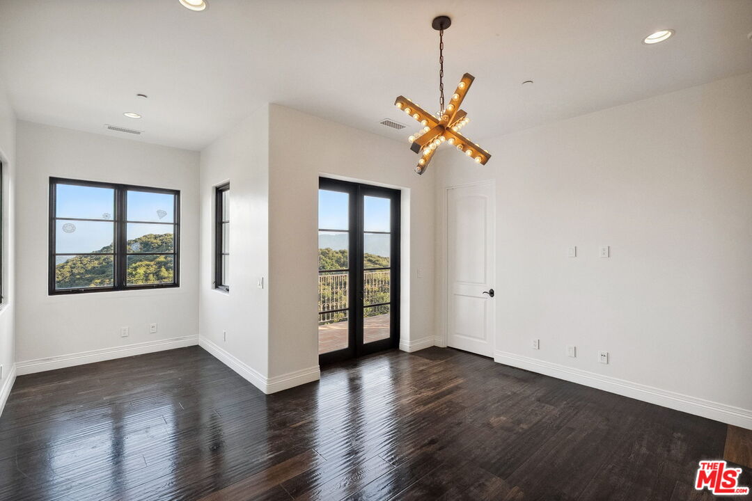 1650 Luse Tank Road Topanga, CA 90290 - Photo 39 of 50 a view of a room with wooden floor and ceiling fan