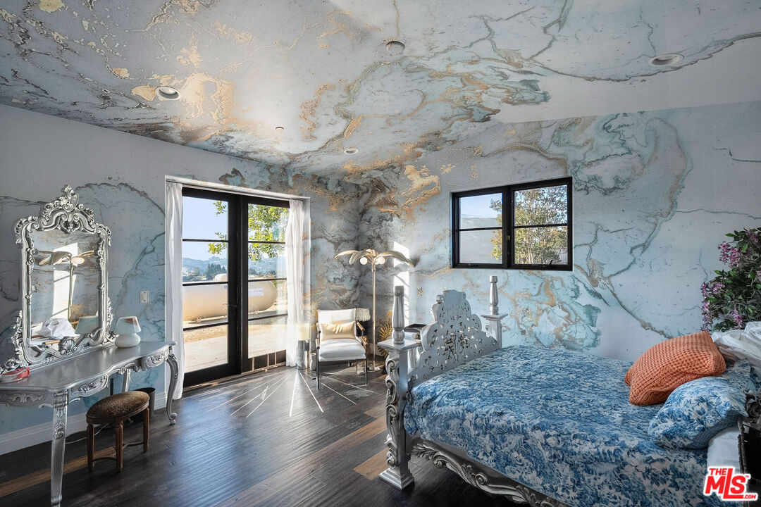 1650 Luse Tank Road Topanga, CA 90290 - Photo 44 of 50 a living room with furniture flowerpot and wooden floor