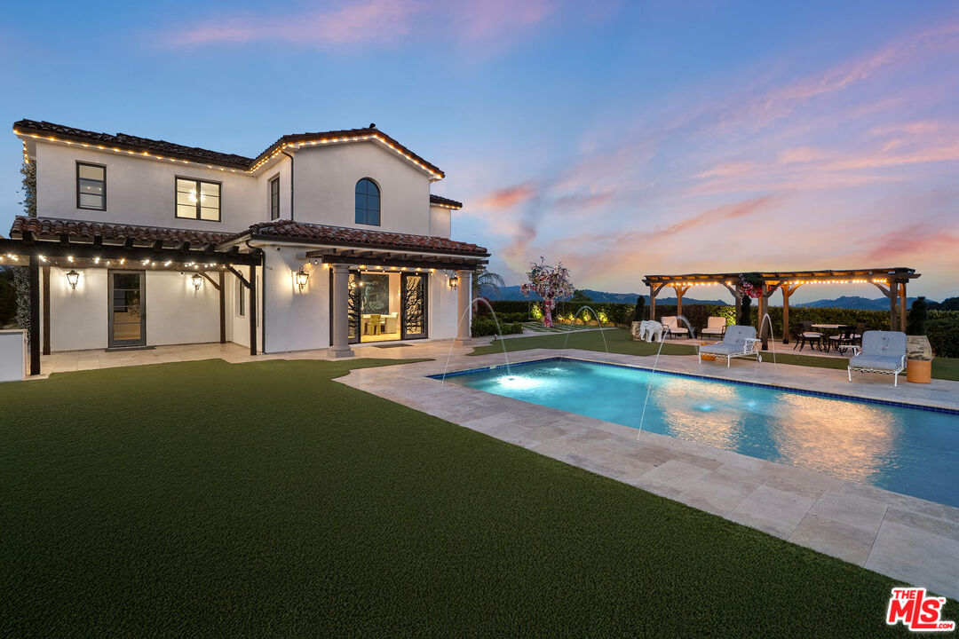 1650 Luse Tank Road Topanga, CA 90290 - Photo 46 of 50 a view of a big house with a swimming pool