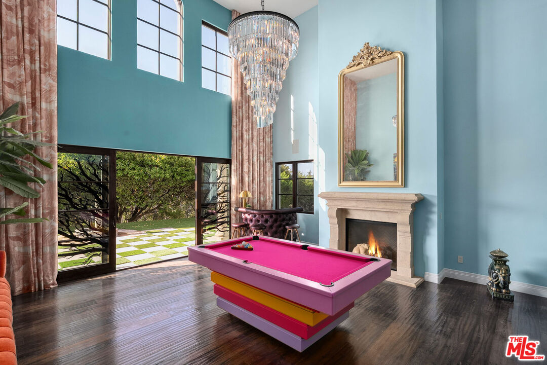 1650 Luse Tank Road Topanga, CA 90290 - Photo 7 of 50 a living room with furniture pool table wooden floor and windows