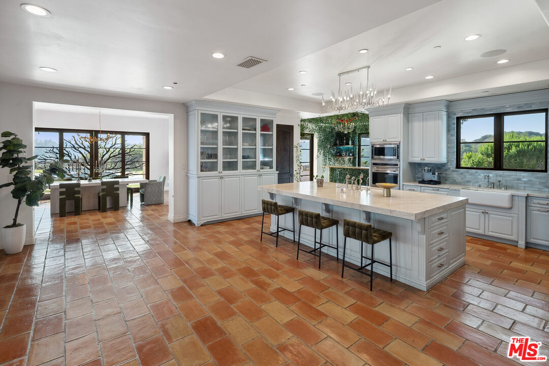 1650 Luse Tank Road Topanga, CA 90290 - Photo 9 of 50 a kitchen with stainless steel appliances granite countertop a stove and a sink