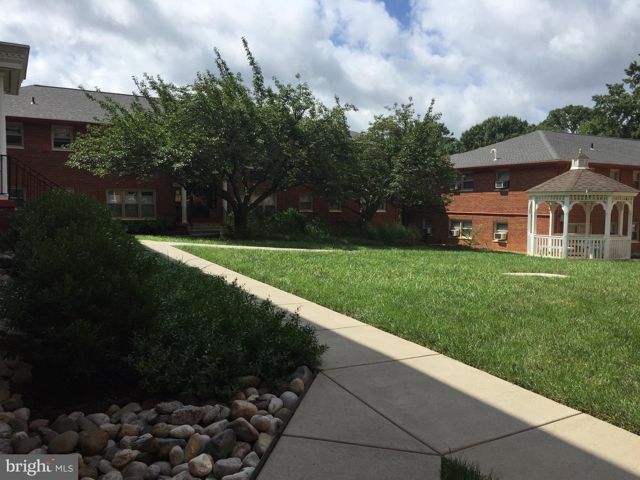 4635 20th Road North, Unit 11 Arlington, VA 22207 - Photo 1 of 22 a front view of house with yard and green space