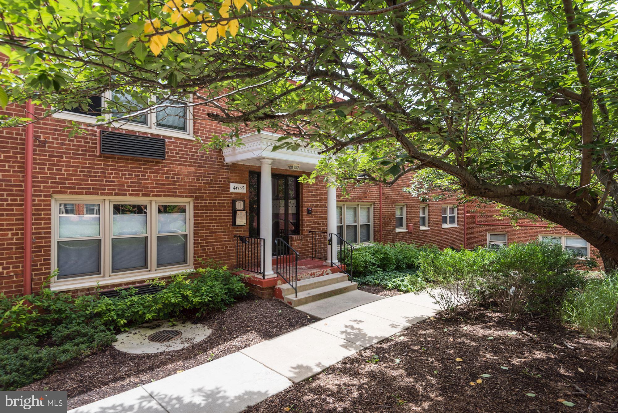 4635 20th Road North, Unit 11 Arlington, VA 22207 - Photo 2 of 22 a front view of a house with garden and trees