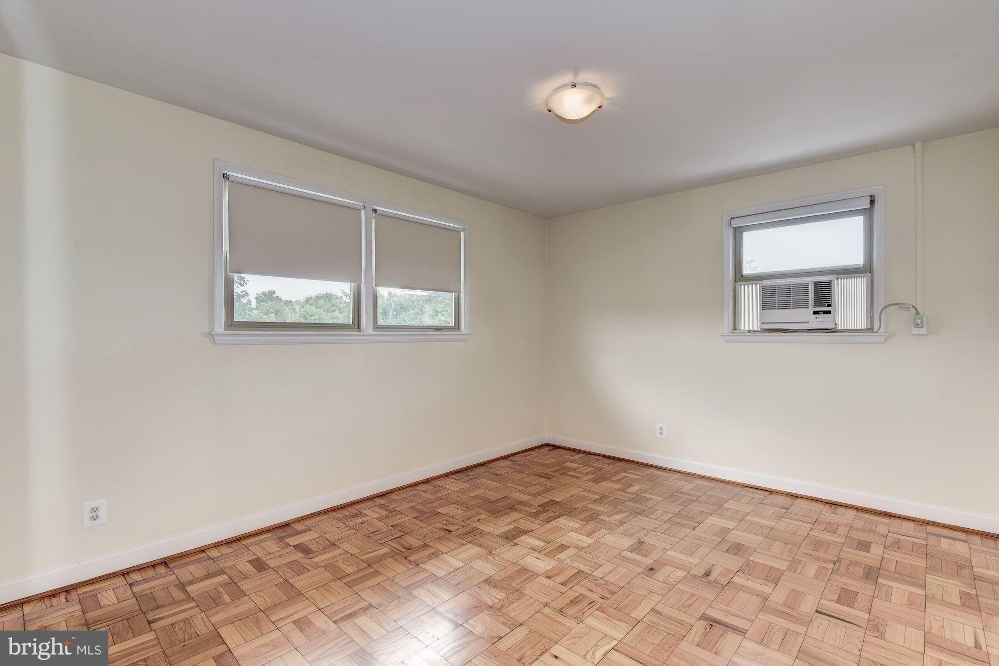 4635 20th Road North, Unit 11 Arlington, VA 22207 - Photo 13 of 22 a view of a big room with wooden floor and windows