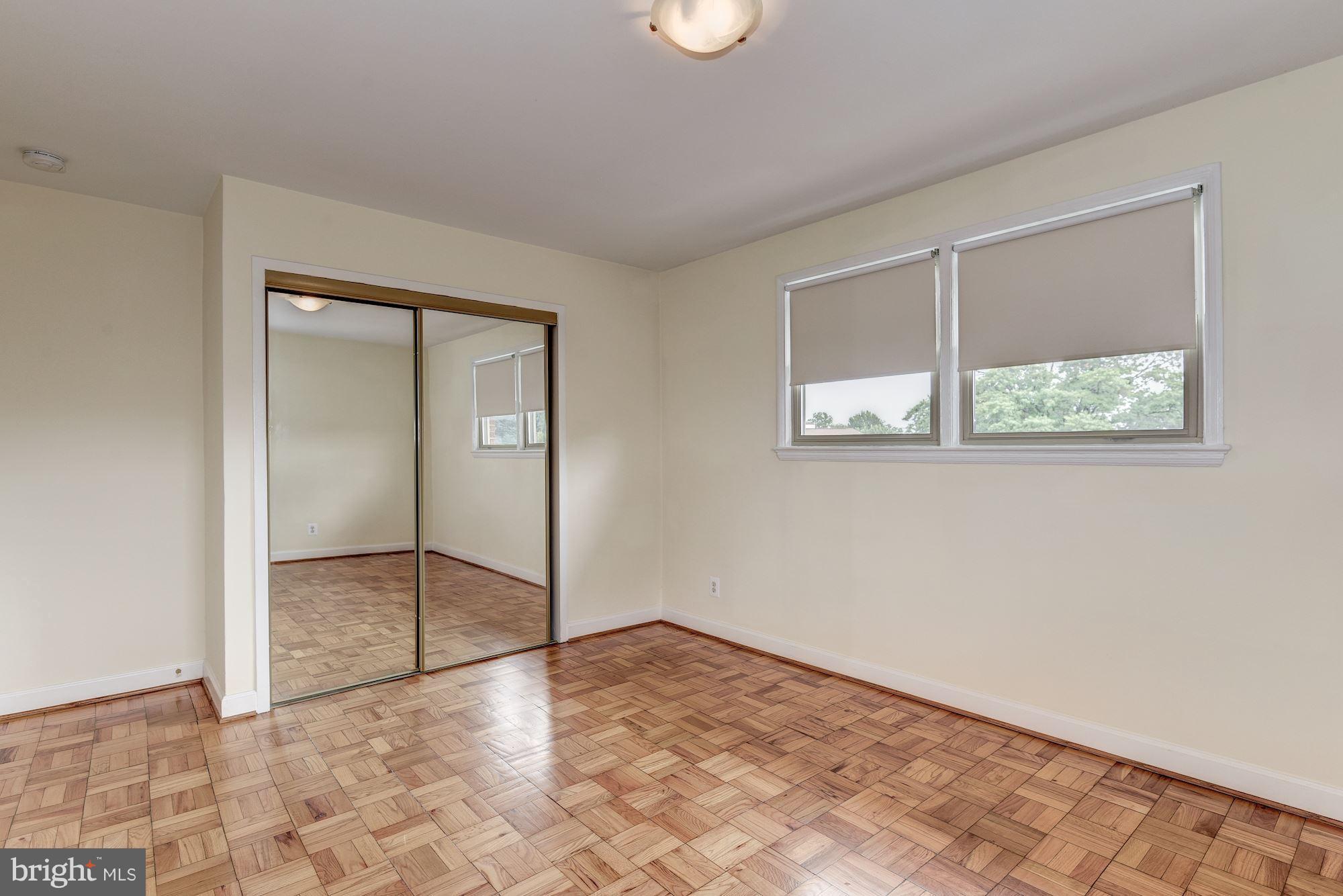 4635 20th Road North, Unit 11 Arlington, VA 22207 - Photo 14 of 22 a view of an empty room with window and closet area