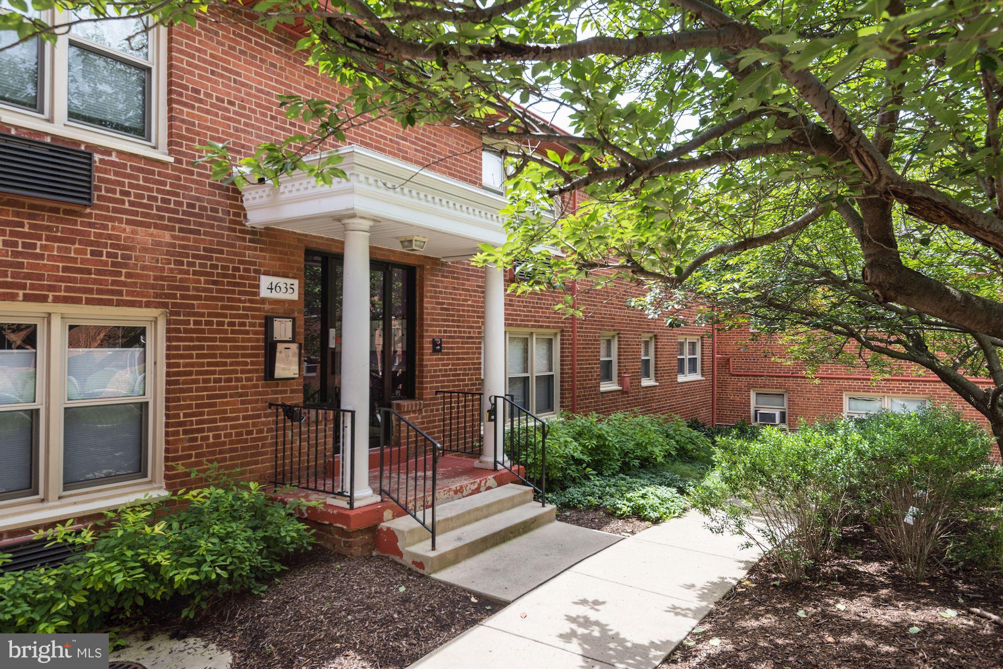 4635 20th Road North, Unit 11 Arlington, VA 22207 - Photo 3 of 22 a front view of a house with a garden