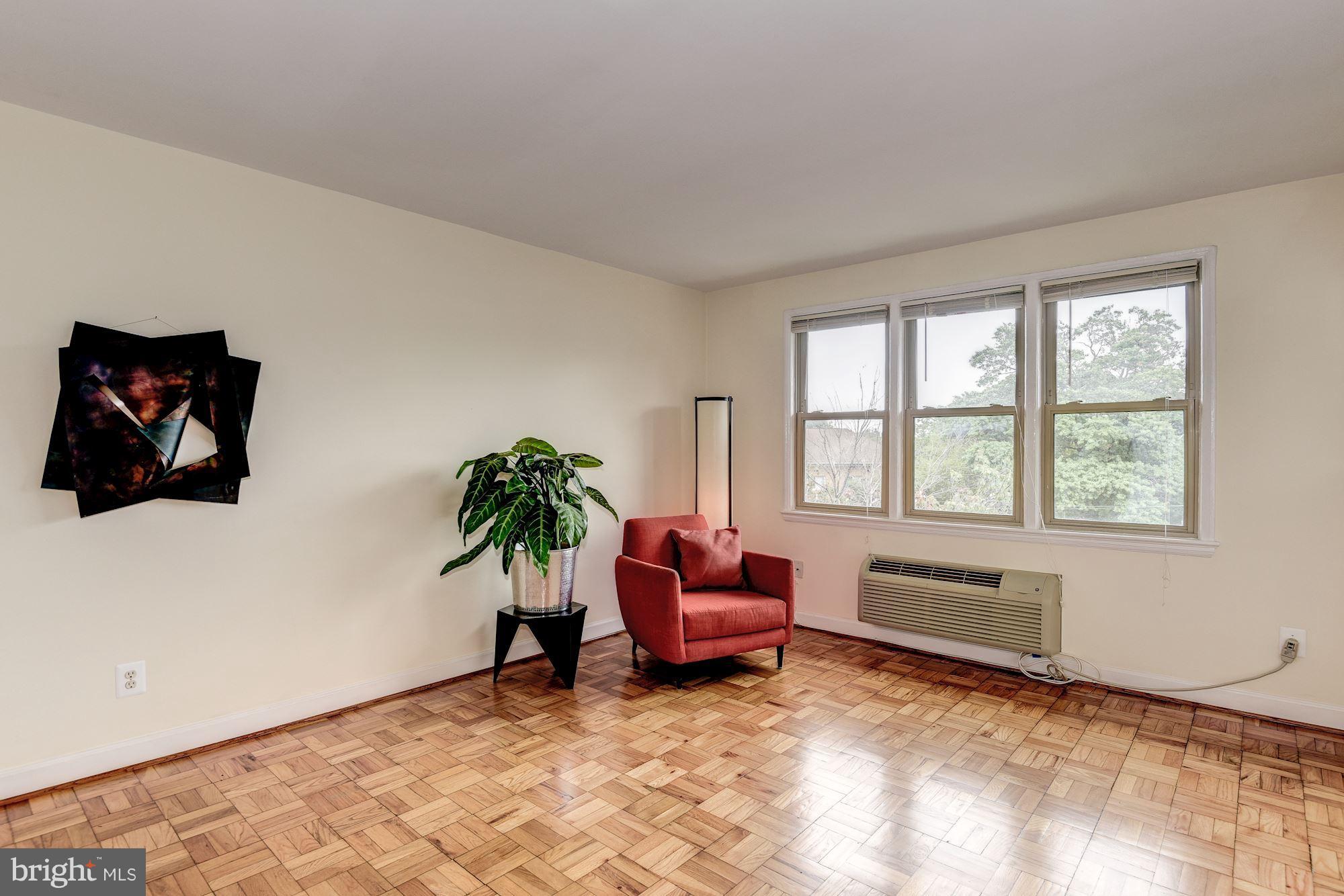 4635 20th Road North, Unit 11 Arlington, VA 22207 - Photo 7 of 22 a living room with furniture and a window
