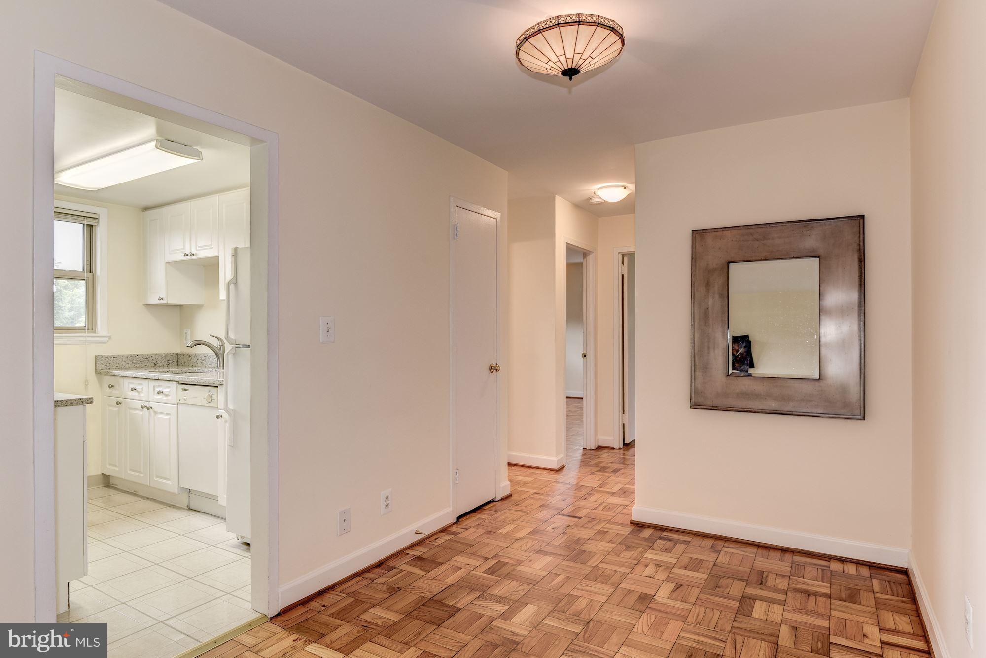 4635 20th Road North, Unit 11 Arlington, VA 22207 - Photo 8 of 22 a view of a hallway with a dining room