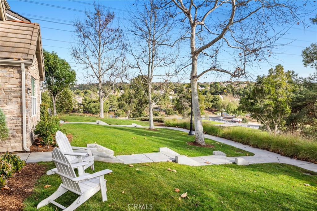18 Bower Lane Ladera Ranch, CA 92694 - Photo 30 of 31 a view of a chair and table in the garden