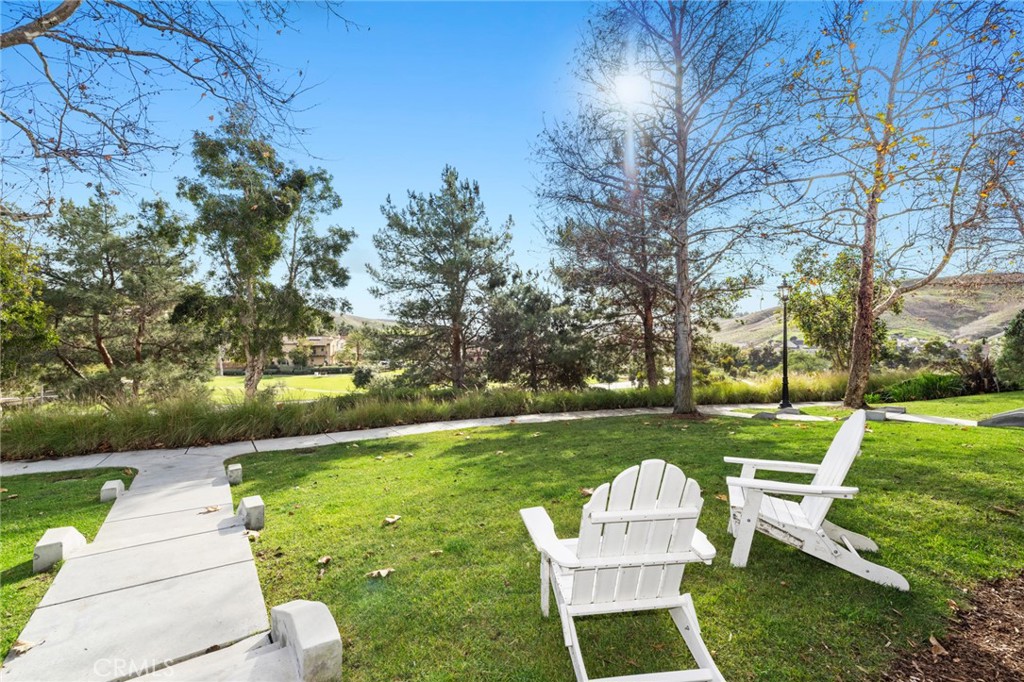 18 Bower Lane Ladera Ranch, CA 92694 - Photo 31 of 31 a garden view with a seating space
