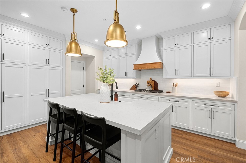 18 Bower Lane Ladera Ranch, CA 92694 - Photo 4 of 31 a kitchen with cabinets appliances and a center island