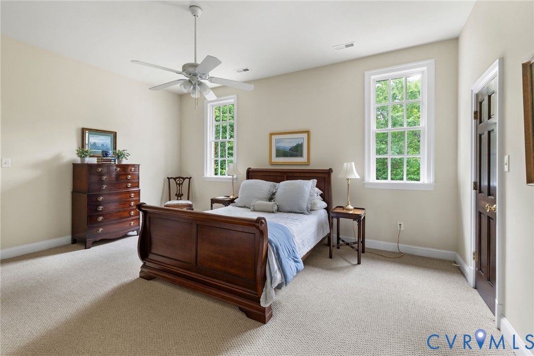 13173 Scotchtown Road Beaverdam, VA 23015 - Photo 42 of 65 a spacious bedroom with a bed and a window
