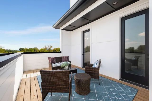 a view of a sink and dishwasher with wooden cabinets