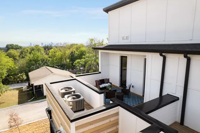 a view of a balcony with city view