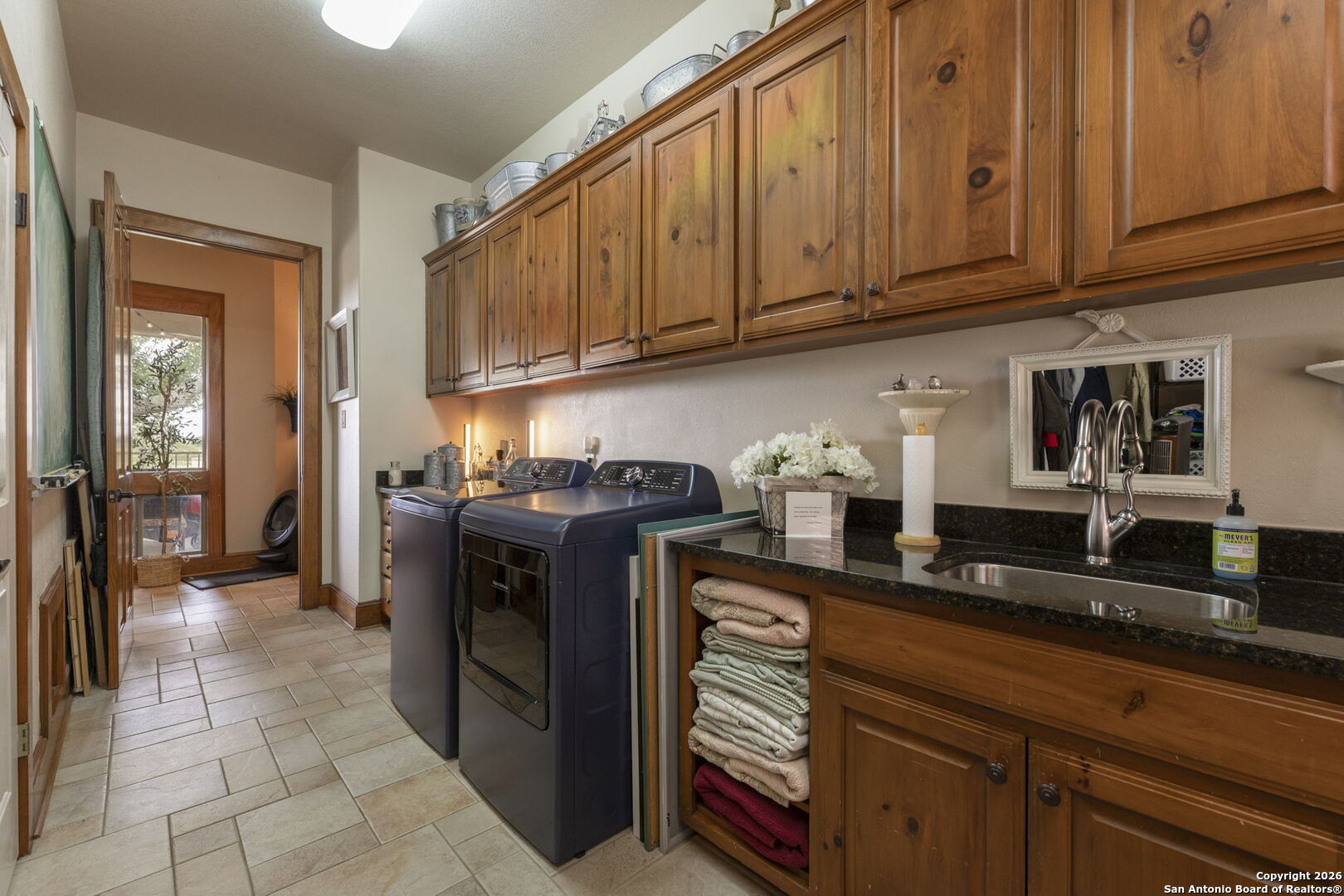 241 Seewald Road Boerne, TX 78006 - Photo 24 of 48 a kitchen with stainless steel appliances granite countertop a refrigerator and a stove top oven
