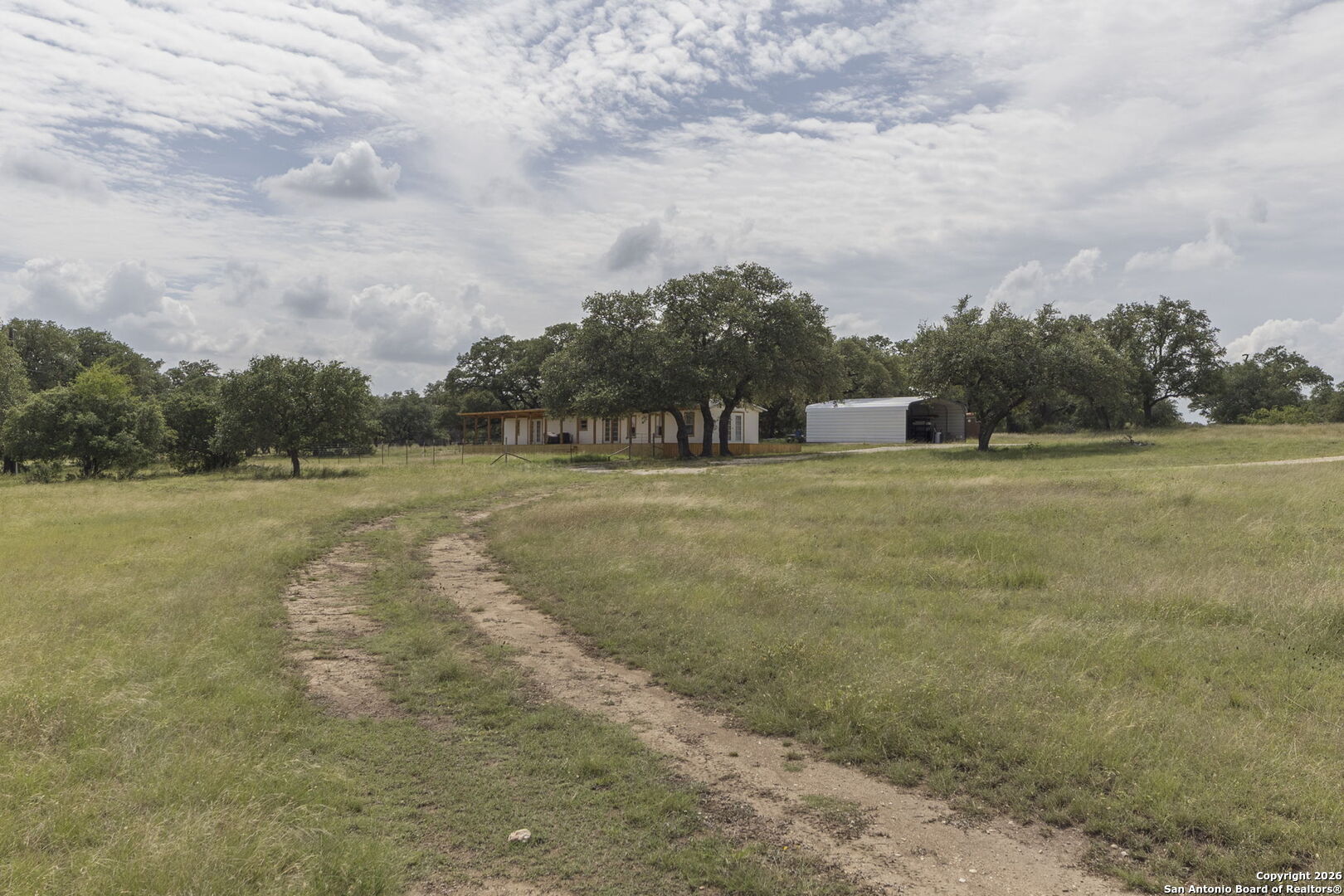 241 Seewald Road Boerne, TX 78006 - Photo 37 of 48 a view of a field with an trees in the background