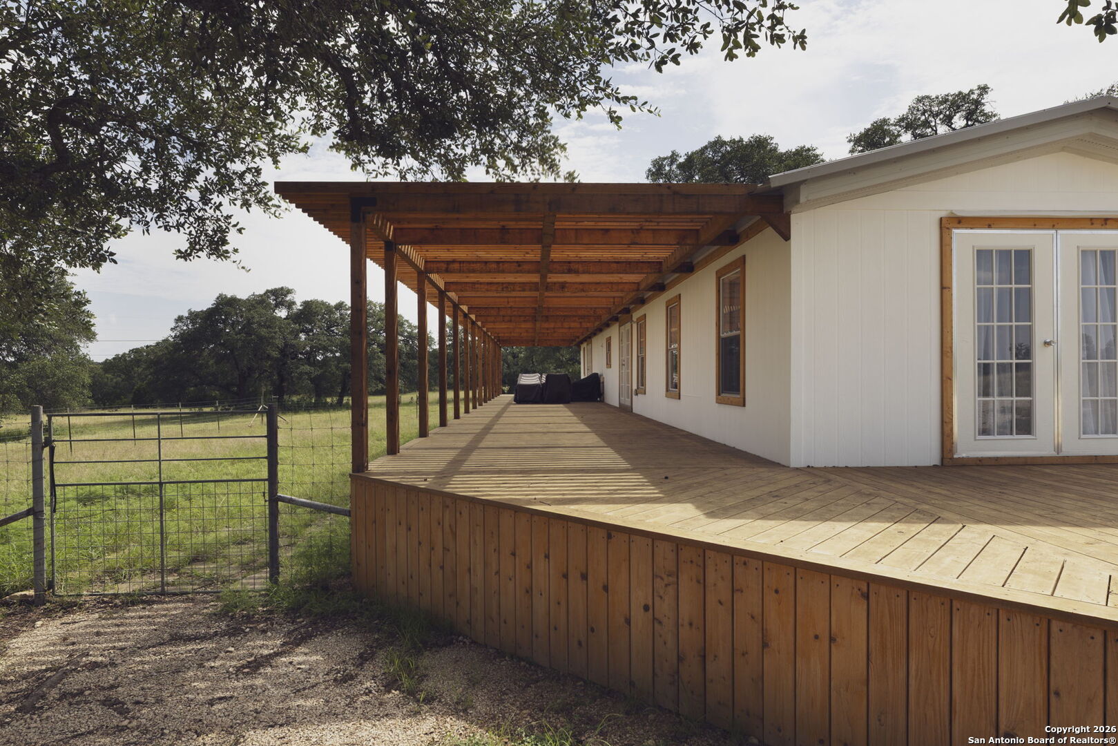 241 Seewald Road Boerne, TX 78006 - Photo 38 of 48 a view of a backyard with wooden fence