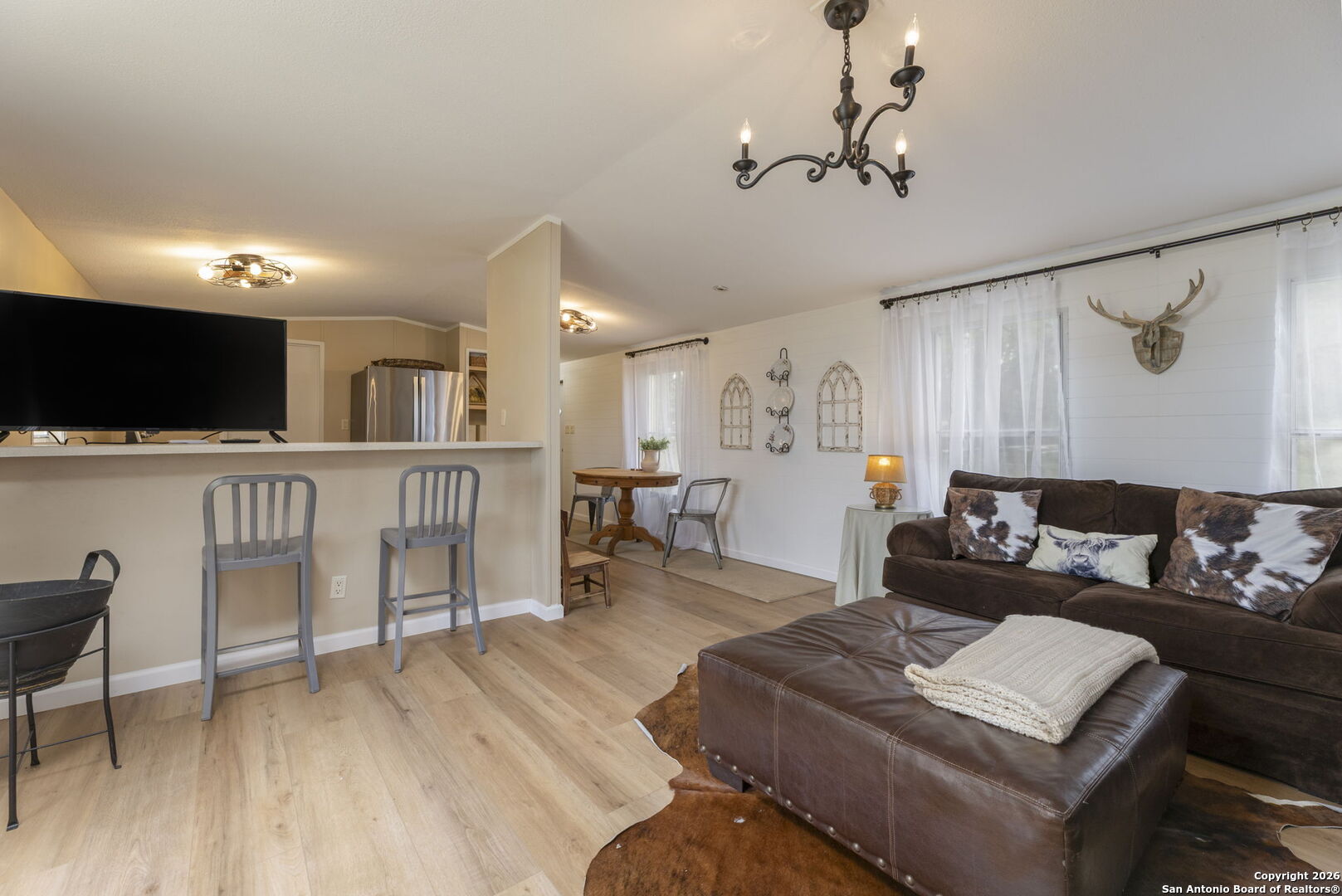 241 Seewald Road Boerne, TX 78006 - Photo 39 of 48 a living room with furniture and a flat screen tv
