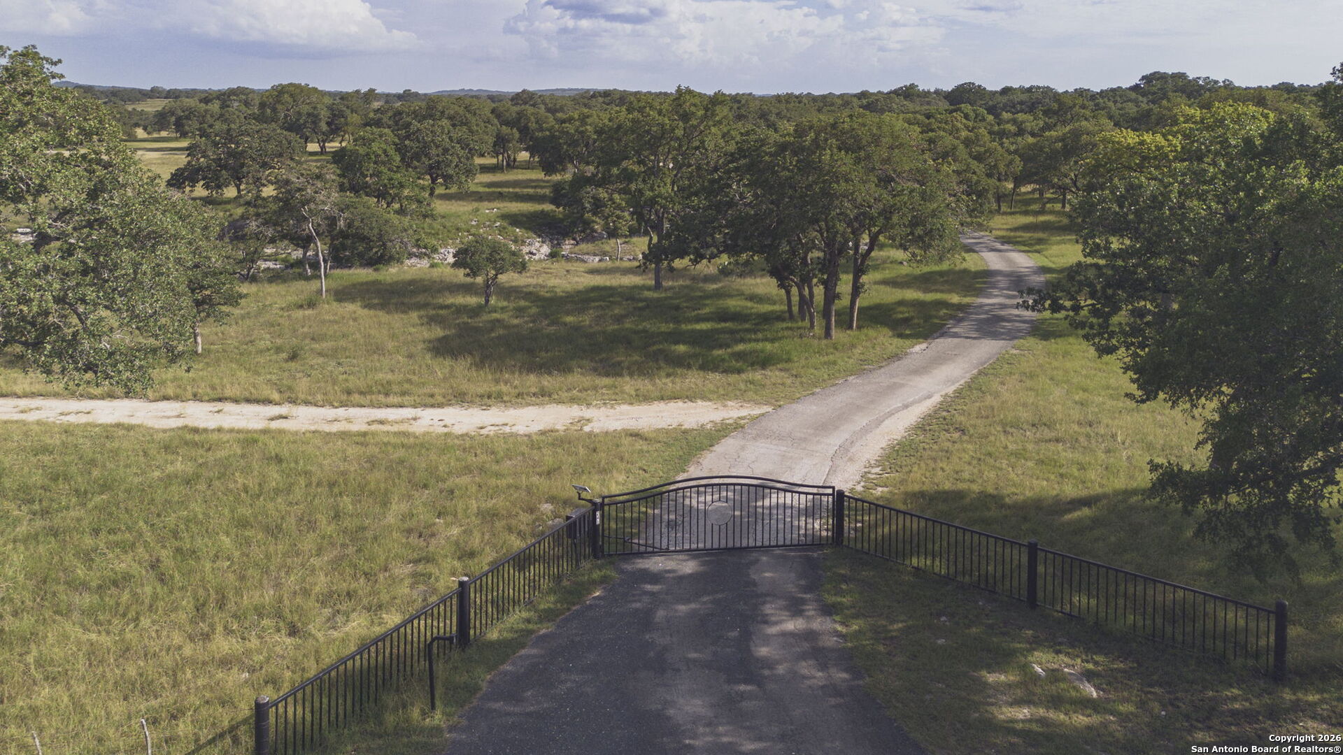 241 Seewald Road Boerne, TX 78006 - Photo 47 of 48 a view of a lake with a mountain in the background