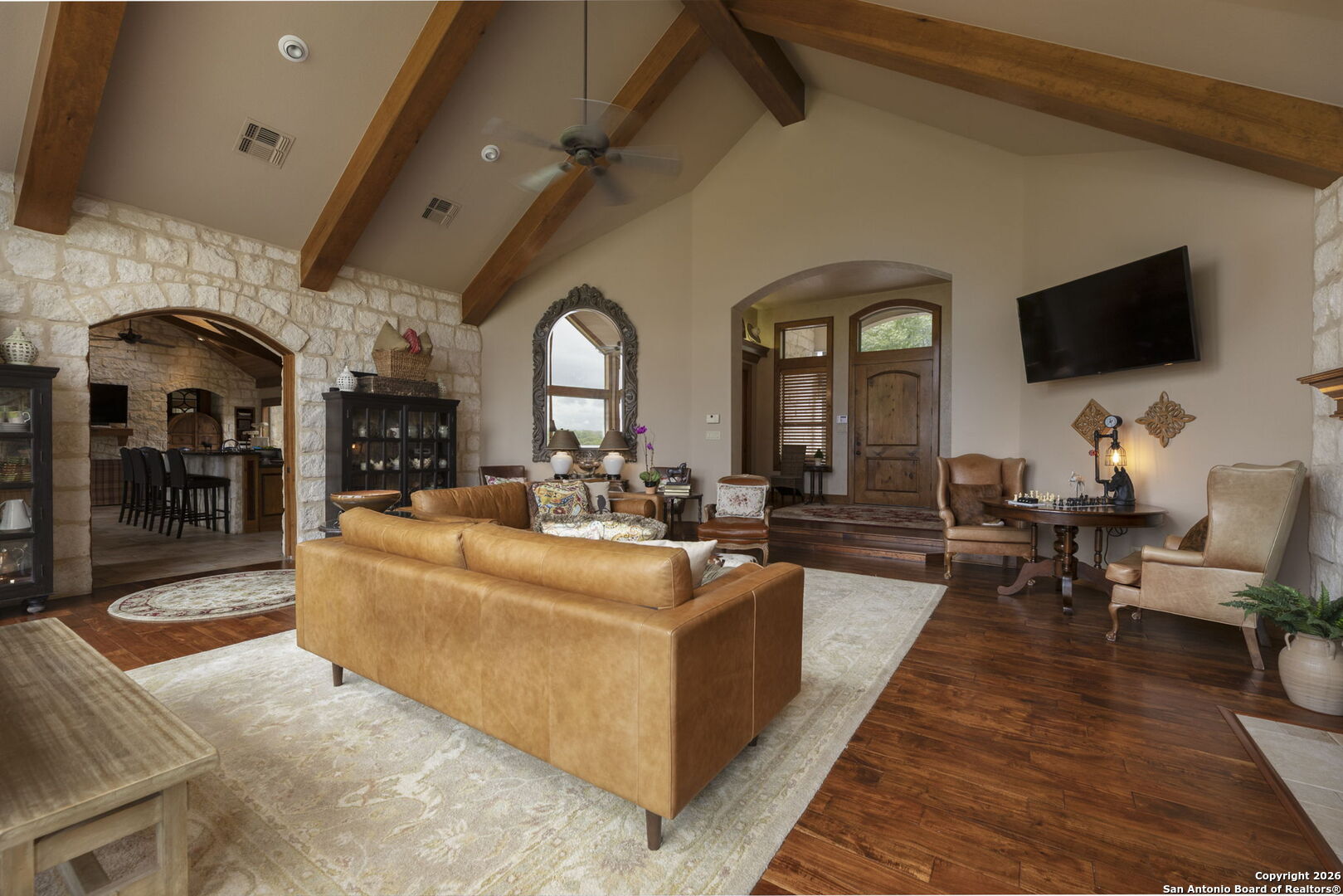 241 Seewald Road Boerne, TX 78006 - Photo 7 of 48 a living room with fireplace furniture and a flat screen tv
