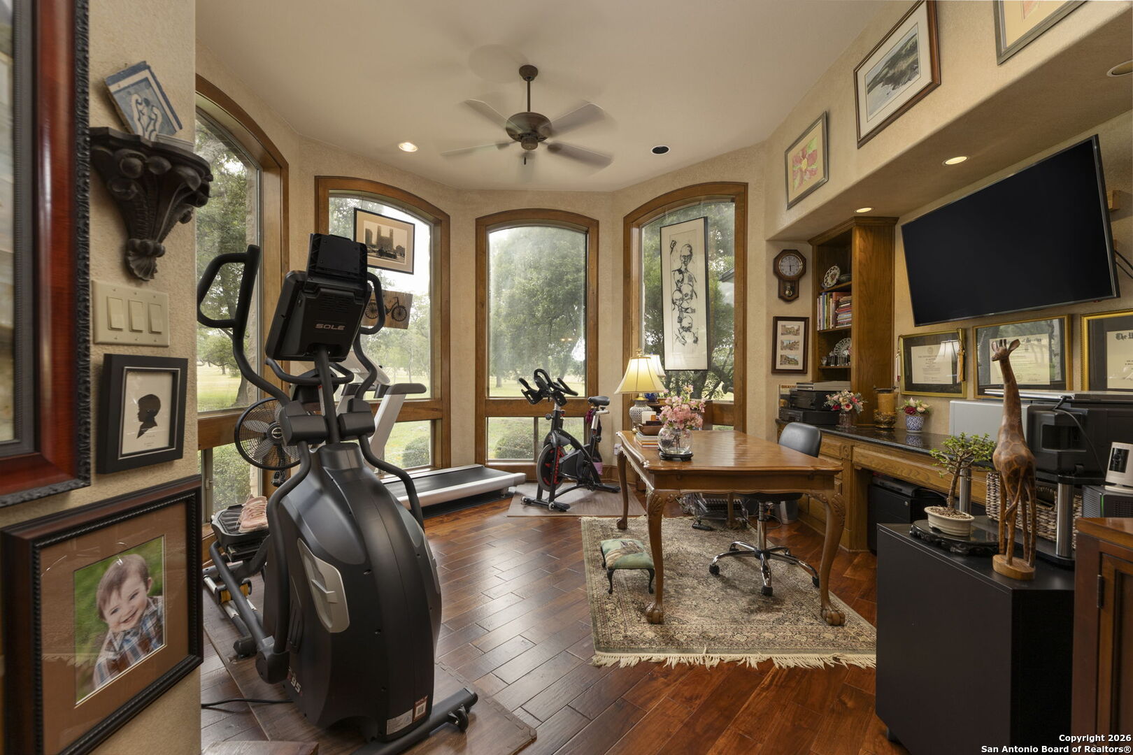 241 Seewald Road Boerne, TX 78006 - Photo 10 of 48 a living room with lots of furniture and a flat screen tv