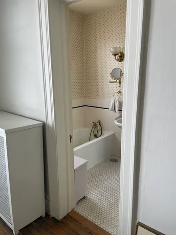 a view of a bathroom with a sink and mirror