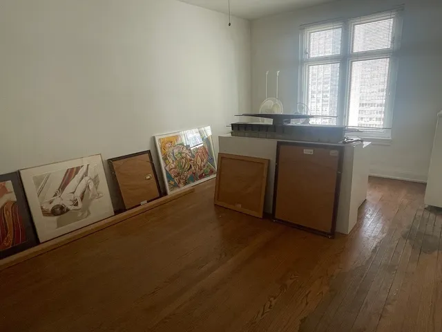 a kitchen with granite countertop a sink a stove cabinets and wooden floor