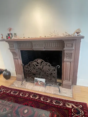 a view of fireplace and living room