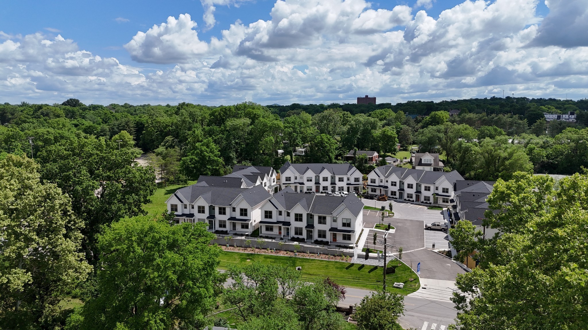 145 Whitsett Road, Unit 6 Nashville, TN 37210 - Photo 3 of 33 a view of a house with a big yard and large trees