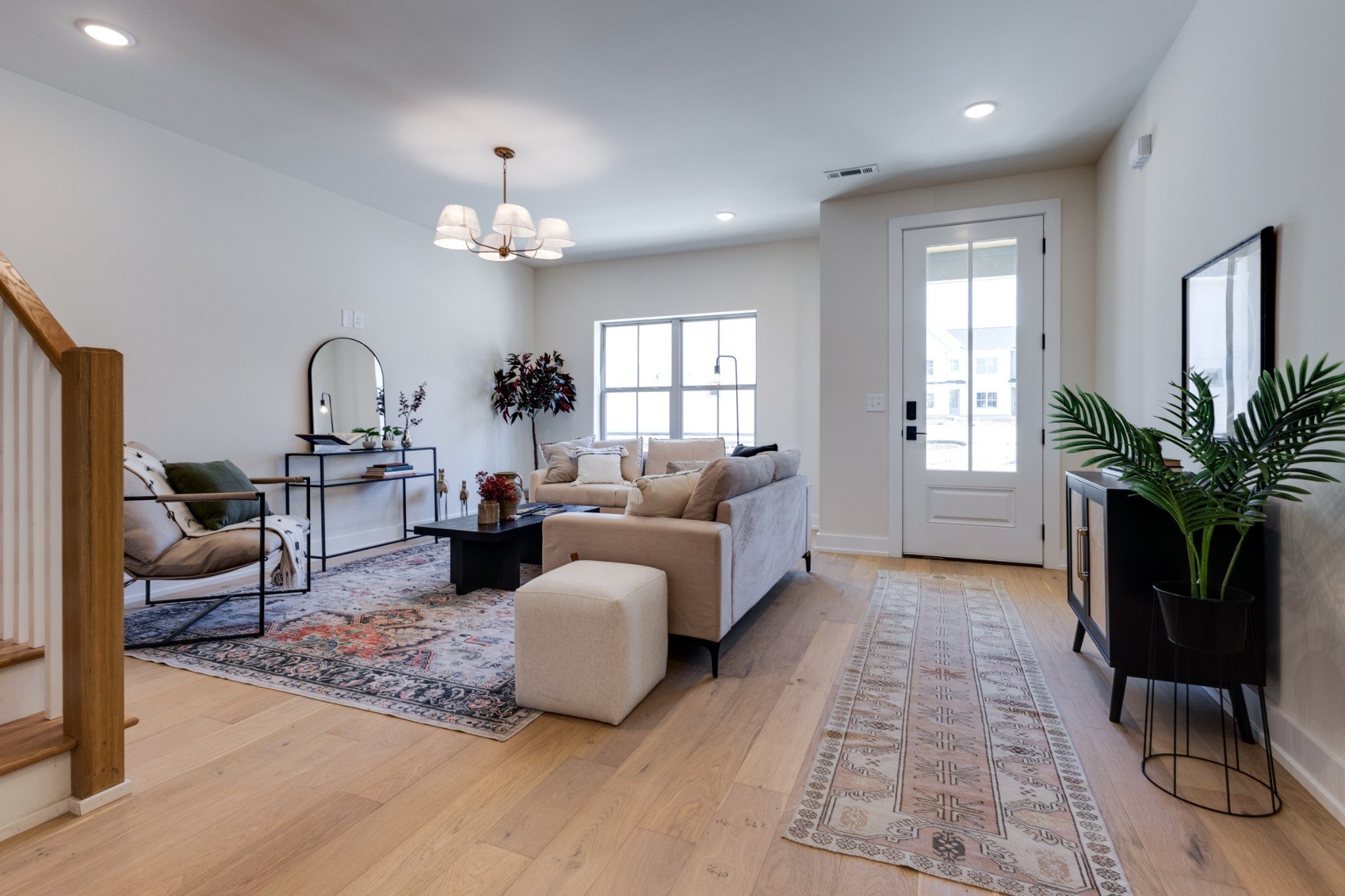 145 Whitsett Road, Unit 6 Nashville, TN 37210 - Photo 8 of 33 a living room with furniture potted plant and a chandelier
