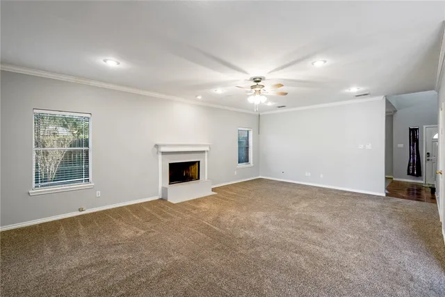 a view of an empty room with a fireplace