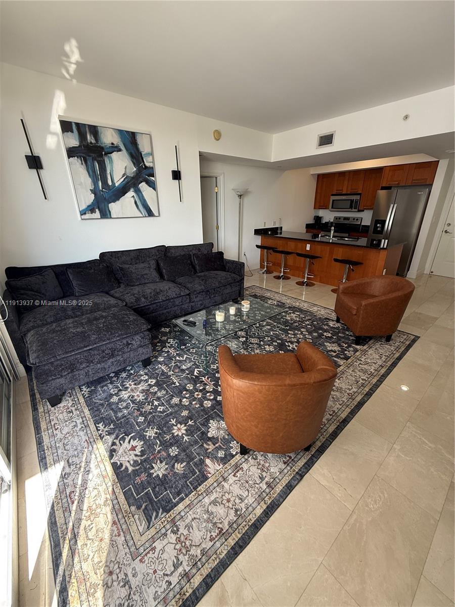 4100 Salzedo Street, Unit 811 Coral Gables, FL 33146 - Photo 11 of 28 a living room with furniture and a couch