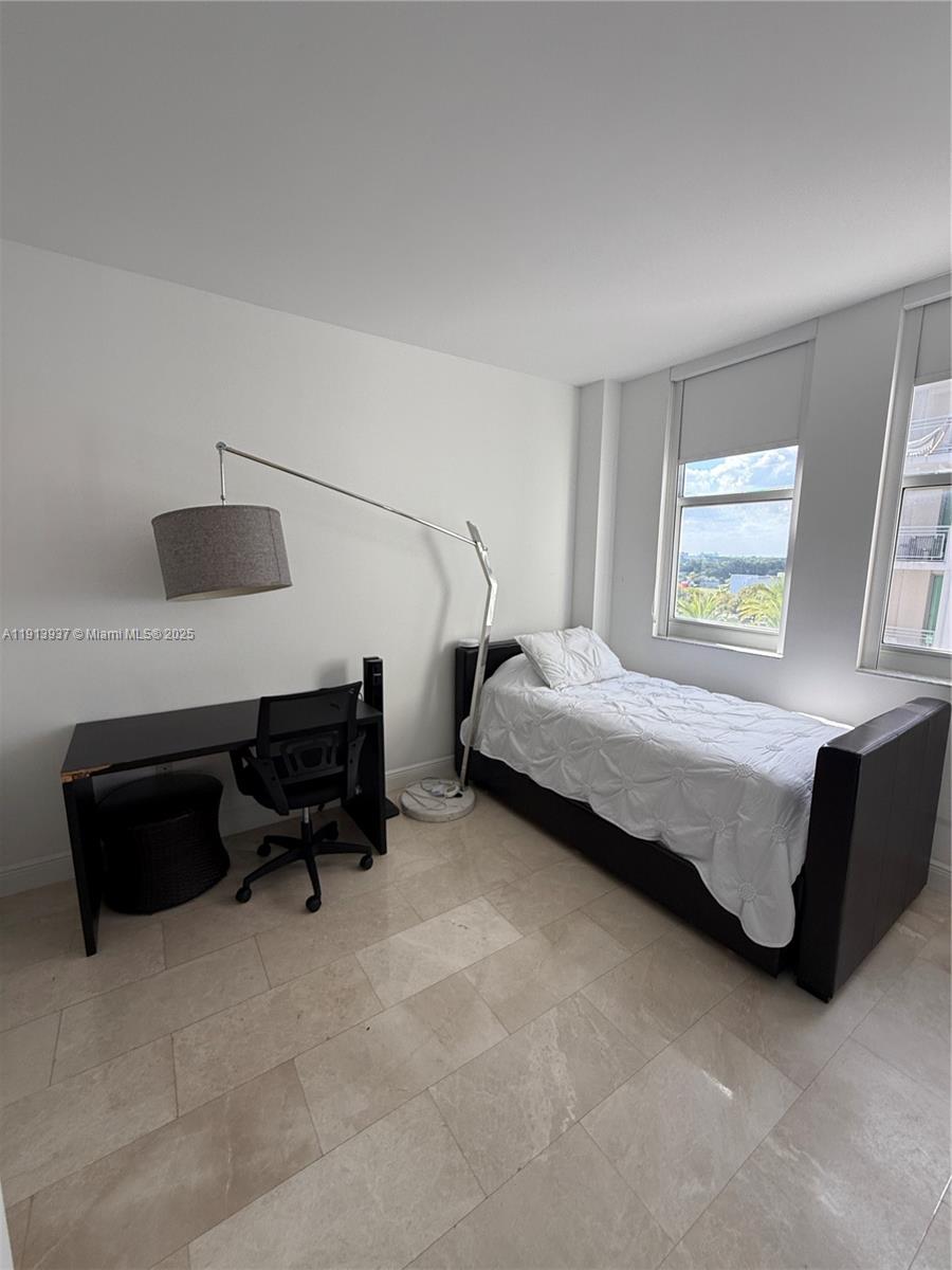 4100 Salzedo Street, Unit 811 Coral Gables, FL 33146 - Photo 25 of 28 a bedroom with bed and a window